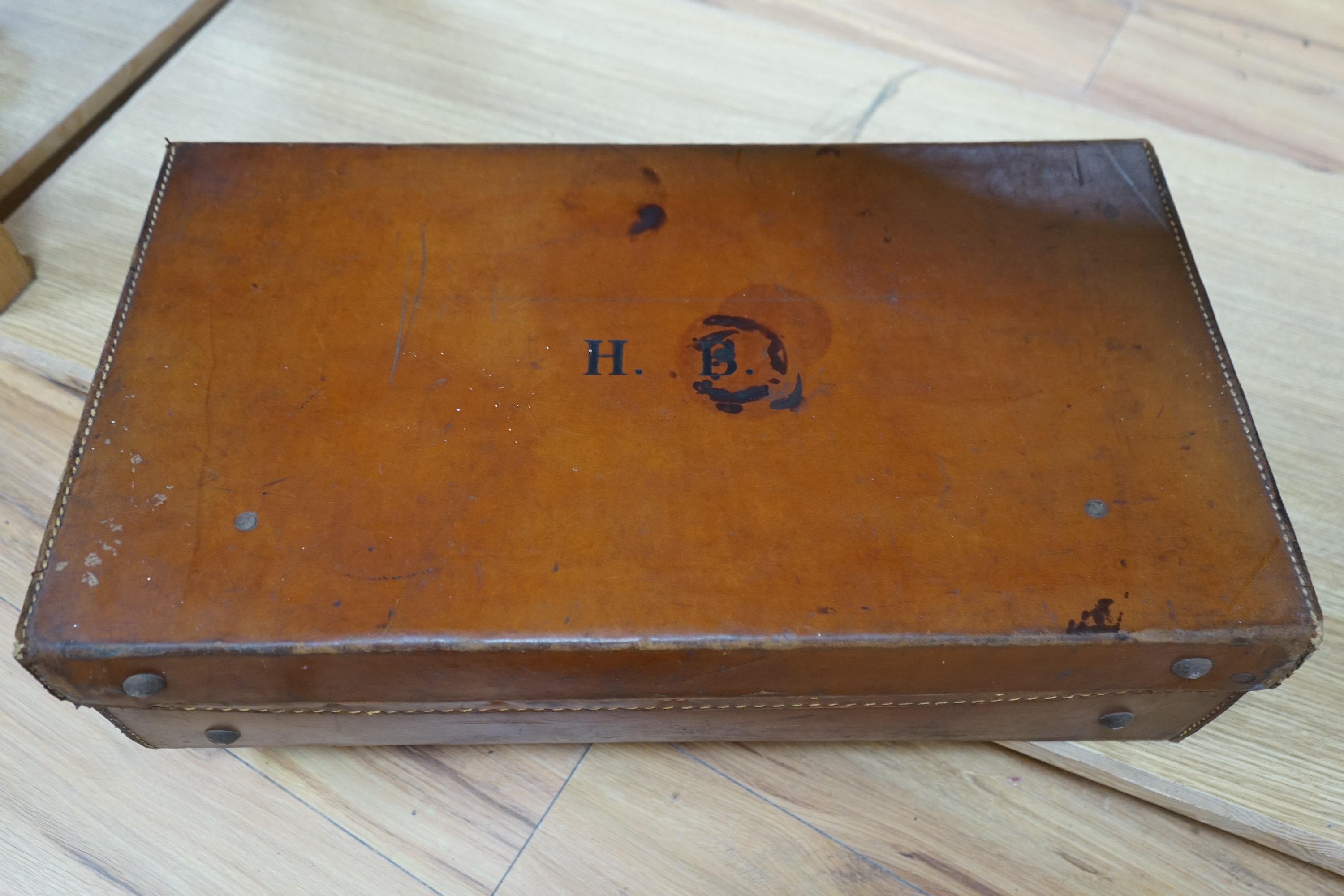 A gun case, various gun cleaning equipment and a brown leather suitcase. Condition - fair